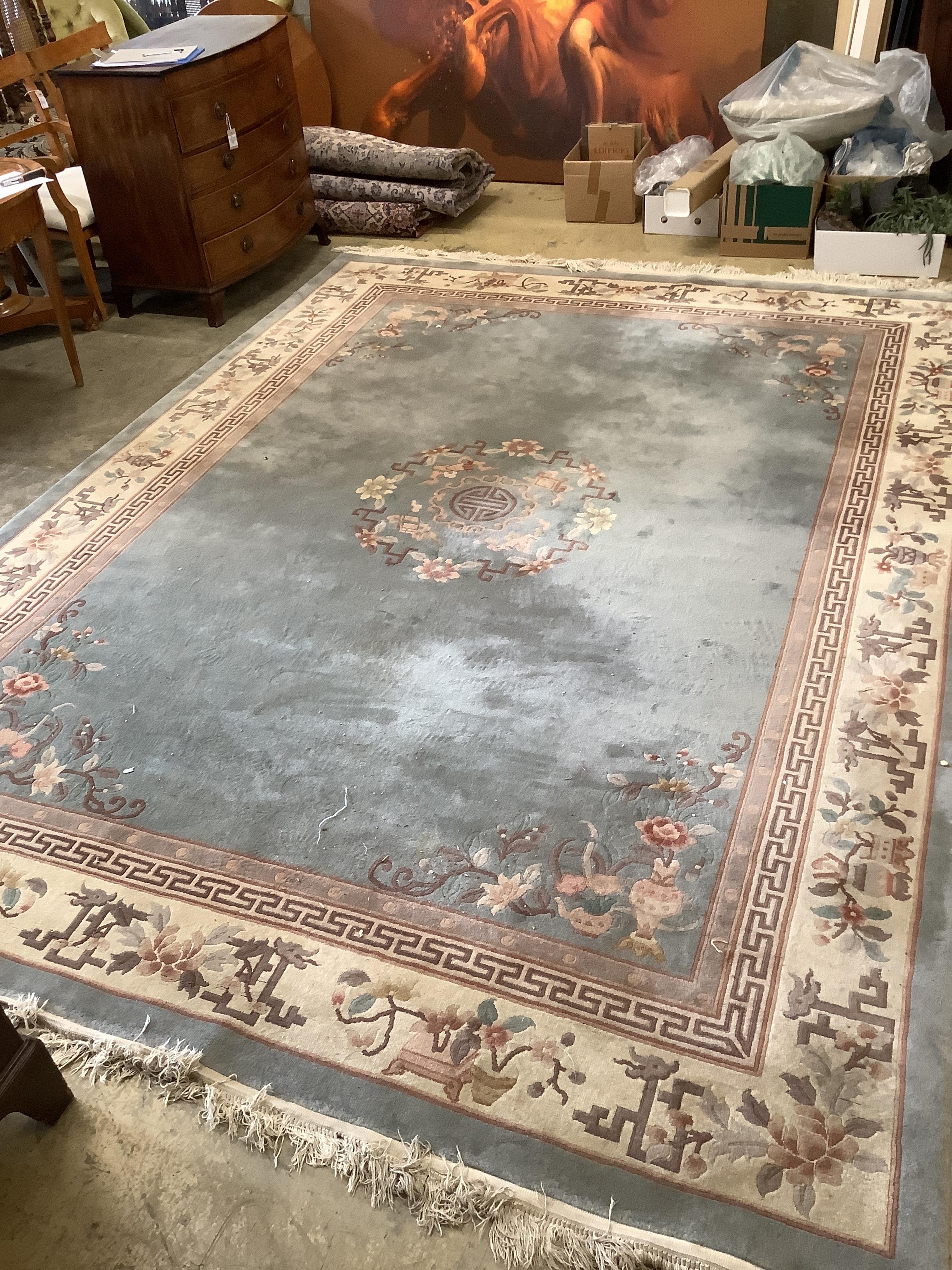 A Chinese celadon ground floral carpet, 370 x 272cm